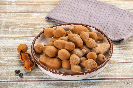 Tropical exotic Tamarind fruit heap
