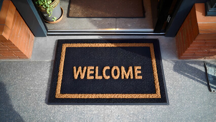 Obraz premium welcome mat at coffee shop, small business concept