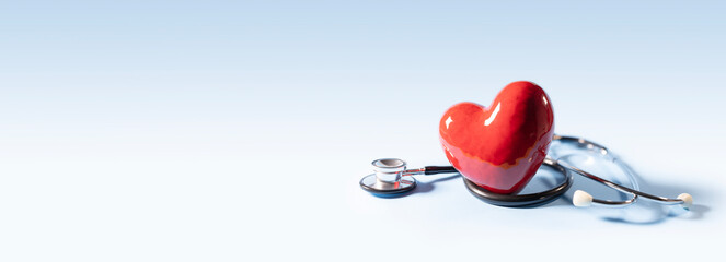 Stethoscope and heart background banner with copy space
