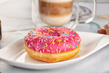 Sweet donut with strawberry icing