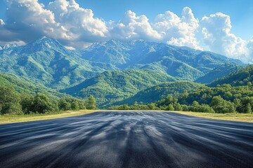 Fototapeta premium Scenic Winding Road Through Green Mountain Landscape with Clouds and Blue Sky