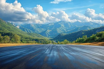 Selbstklebende Fototapeten Winding Road Through Vibrant Green Mountain Landscape under Blue Sky © k