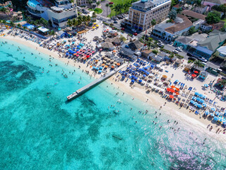 Aerial of the popular and busy Junkanoo beach at the Western Esplanade next to Nassau town, The Bahamas