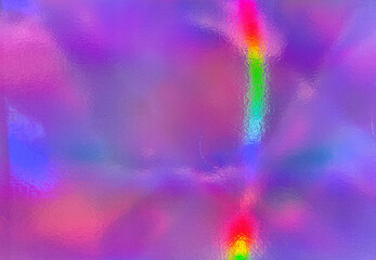 The image features an abstract, colorful texture with a holographic or iridescent effect. The...