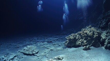 Fototapeta premium Ocean Deep: Divers Exploring Underwater Cave