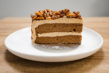 Caramel Almond Toffee Cake. Brown needle coffee cake in a separate container on a wooden table