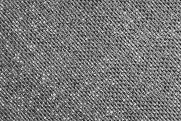 Upholstery gray colored jacquard fabric diagonal coarse weave texture close up, macro. Textile background, furniture textile material, wallpaper, backdrop. Cloth structure close up, macro