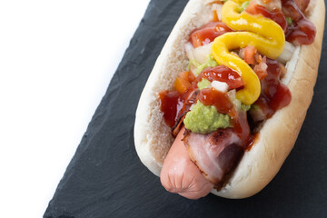 Sonoran hot dog. Traditional Mexican hot dog isolated on white background. Close up