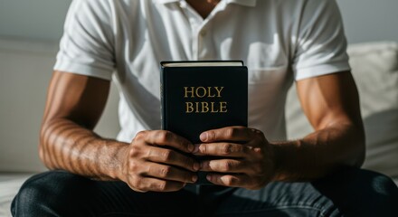 Strong Faith: Athletic Black Man Holding the Holy Bible