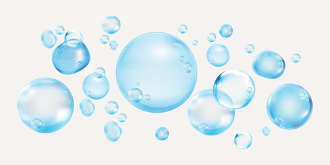 Floating blue bubbles on a white background. Various sizes of blue bubbles create a light, airy feel. Blue bubbles add a whimsical touch to the design. Soap bubble element vector set.