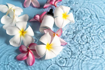 Gardinen Experience deep hydration as plumeria petals surround a soothing serum, creating a calming ambiance. © Alisa Chikov