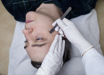A dermatologist takes a skin scraping test for demodicosis and dermatitis, fungal infection....