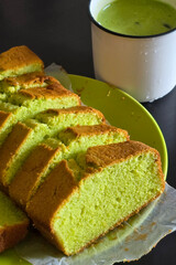 Sliced pandan butter cake with green tea

