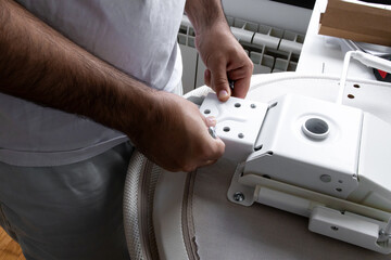Male assembling furniture with adjustable mechanism at home