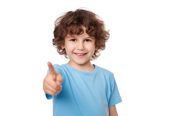 Cute smiling boy in blue t-shirt pointing right with finger smile hand white background.