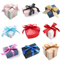 Different gift boxes with ribbon bows on white background, set