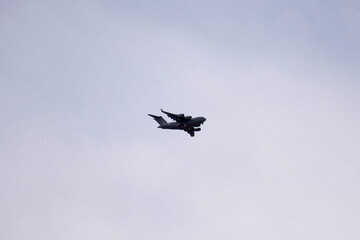 Jumbo plane of indian soldier flying on sky of Leh Ladakh village near Tsemo Maitreya Temple or Namgyal Tsemo Monastery in Jammu Kashmir, India