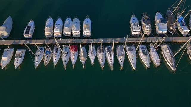 Top-Down Aerial View of Yachts and Sailboats Docked in a Marina