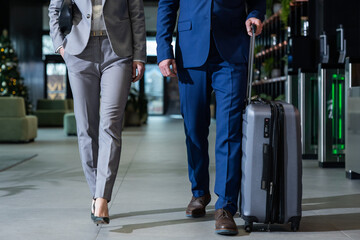 Obraz premium Two people walking to the exit in the airport after arrival