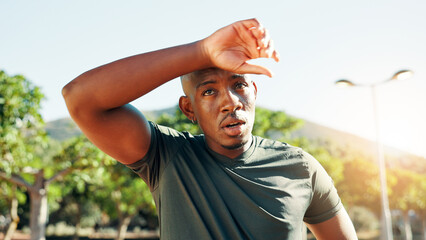 Fitness, tired and black man with breathing in nature for workout performance, running challenge...