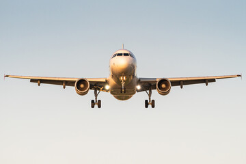 A commercial passenger airplane is ready to land at an airport. 