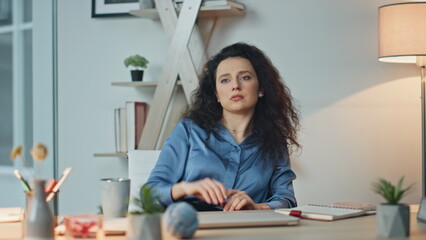 Professional woman rubbing neck at desk. Closeup tired executive taking break