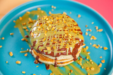 Dubai chocolate kunafa pancakes served at a fancy restaurant cafe.