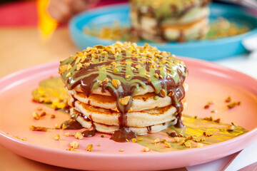 Dubai chocolate kunafa pancakes served at a fancy restaurant cafe.