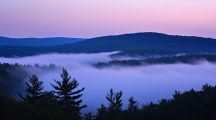 Fototapeta premium Serene Mountain Landscape at Dawn with Mist and Soft Color Palette