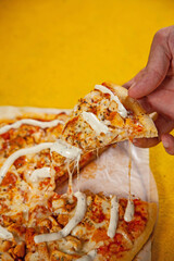 Chicken tikka masala thin crusted pizza baked in wood fired oven