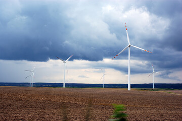 wind farm windmill wind farm on the field against the blue sky
