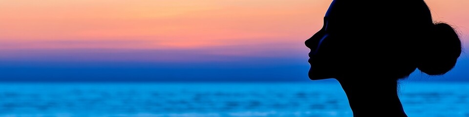 Obraz premium Silhouette Woman Meditation with Tranquility Sunset Background Above The Sea, Peaceful Mind concept