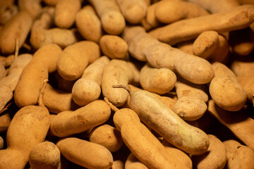 Brown tamarind displaying its natural texture and unique appearance.