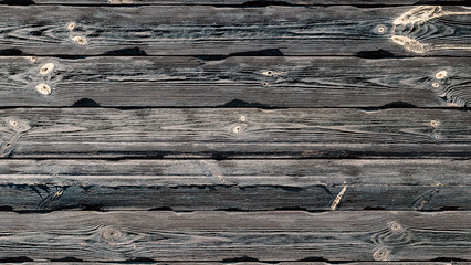 Naklejka premium texture of a dark wooden wall with knots