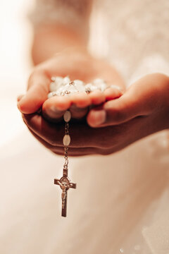Boy Holding Rosary Beads on First Holy Communion Day