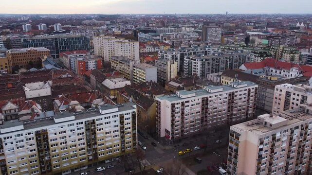 Budapest skyline with historic aerial pullback above dense urban sprawl, as cars and pedestrians navigate bustling area