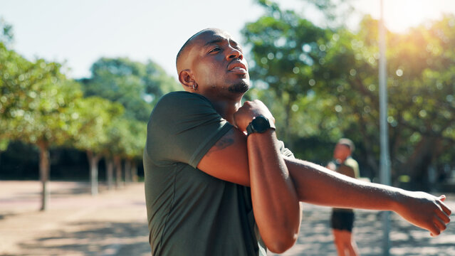 Athlete, black man or stretching arms in park for flexibility for body health, fitness training or exercise. Elbow, muscle warm up or African runner thinking with wellness, mobility workout or sports