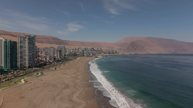 Iquique playa brava chile tarapaca cavancha day beach blue sky slow