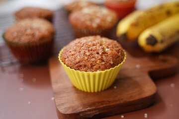 Homemade Banana muffins topped with nuts, selective focus