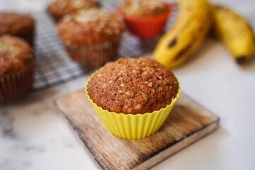 Homemade Banana muffins topped with nuts, selective focus