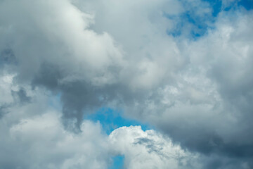 Cumulus clouds in the blue sky on a sunny day.