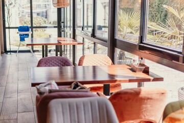 A restaurant with a lot of tables and chairs