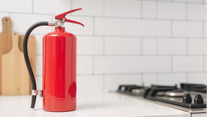 Obraz premium Bright Red Fire Extinguisher in Modern Kitchen – Safety Device for Home Protection and Insurance Renewal 