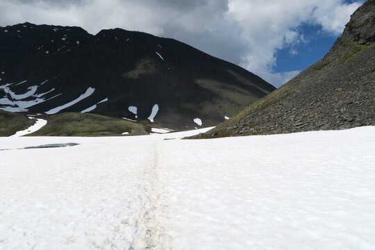 Mountains with lingering snow in midsummer, Crow Pass Trail, Anchorage, Alaska