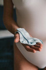 Pregnant Woman Holding Baby Socks in Hand