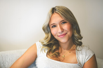 Naklejka premium close portrait of teen in her bedroom in a house interior