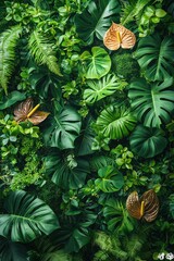 Lush tropical foliage with anthurium flowers and varied green leaves