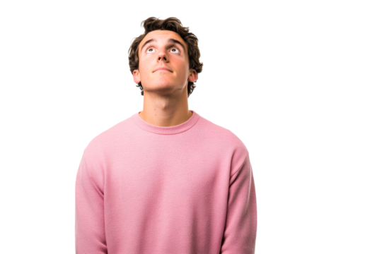 Young man wearing pink sweater looking up with curiosity
