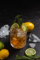Cocktail with lime and rosemary close-up
