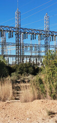 View of a large electrical substation, highlighting the complexity of its cables and structures